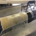 Pin hole filled and new layer of fiberglass applied then wrapped.jpeg
